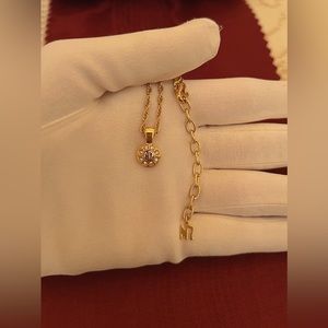 Nina Ricci NR Logo Round Pendant Necklace